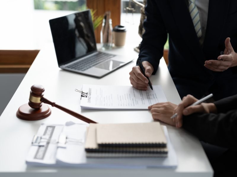 Businessman and lawyer discuss the contract document. Treaty of the law. Sign a contract business